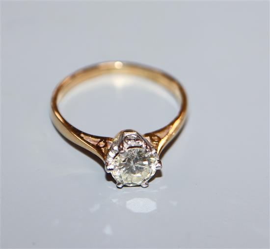 An 18ct yellow metal and solitaire diamond ring, stone approximately 0.65 cts, size K.